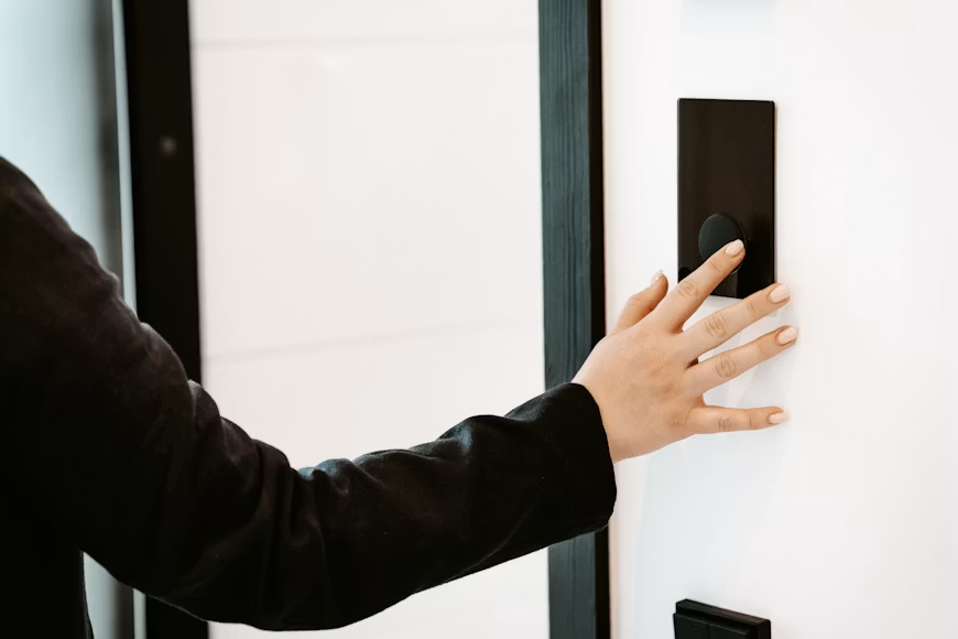 A person touching a smart lock