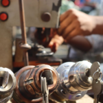 Locksmith working with tools on a key machine