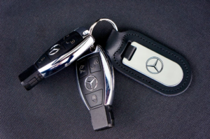 Car keys on a black fabric surface.