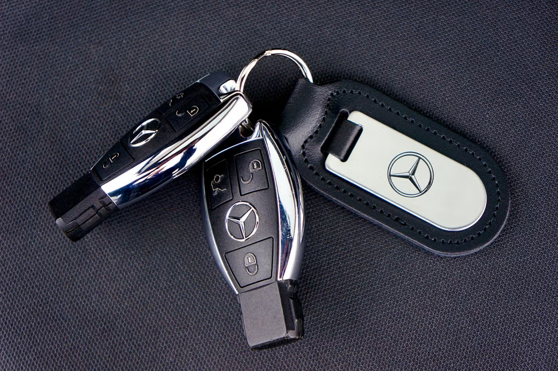 Car keys on a black fabric surface.